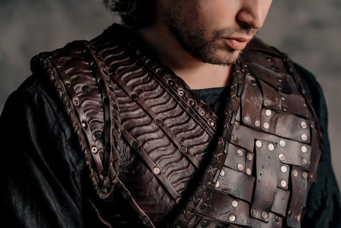 Man wearing dark brown ribbed Ivar-inspired leather armor with layered shoulder pieces