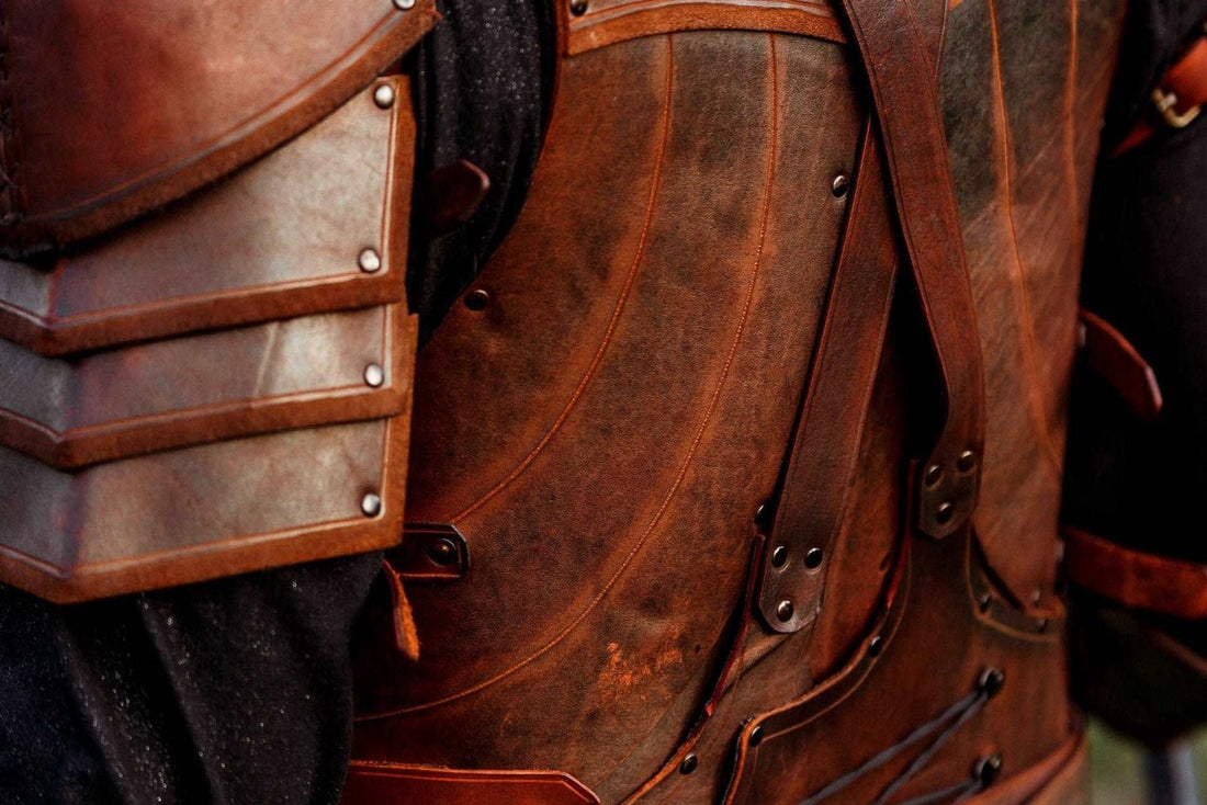Rear detail of the brown Dark Elf cuirass with layered shoulder armor, back straps, and side lacing