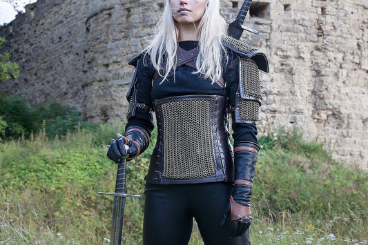 Full-length view of the Kaer Morhen armor costume with fitted torso layers, pauldrons, gloves, pants, and boots