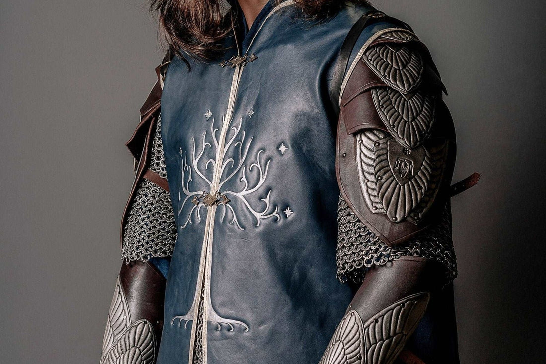 Three-quarter view of the blue leather Aragorn King costume layer with brown shoulder armor and bracers