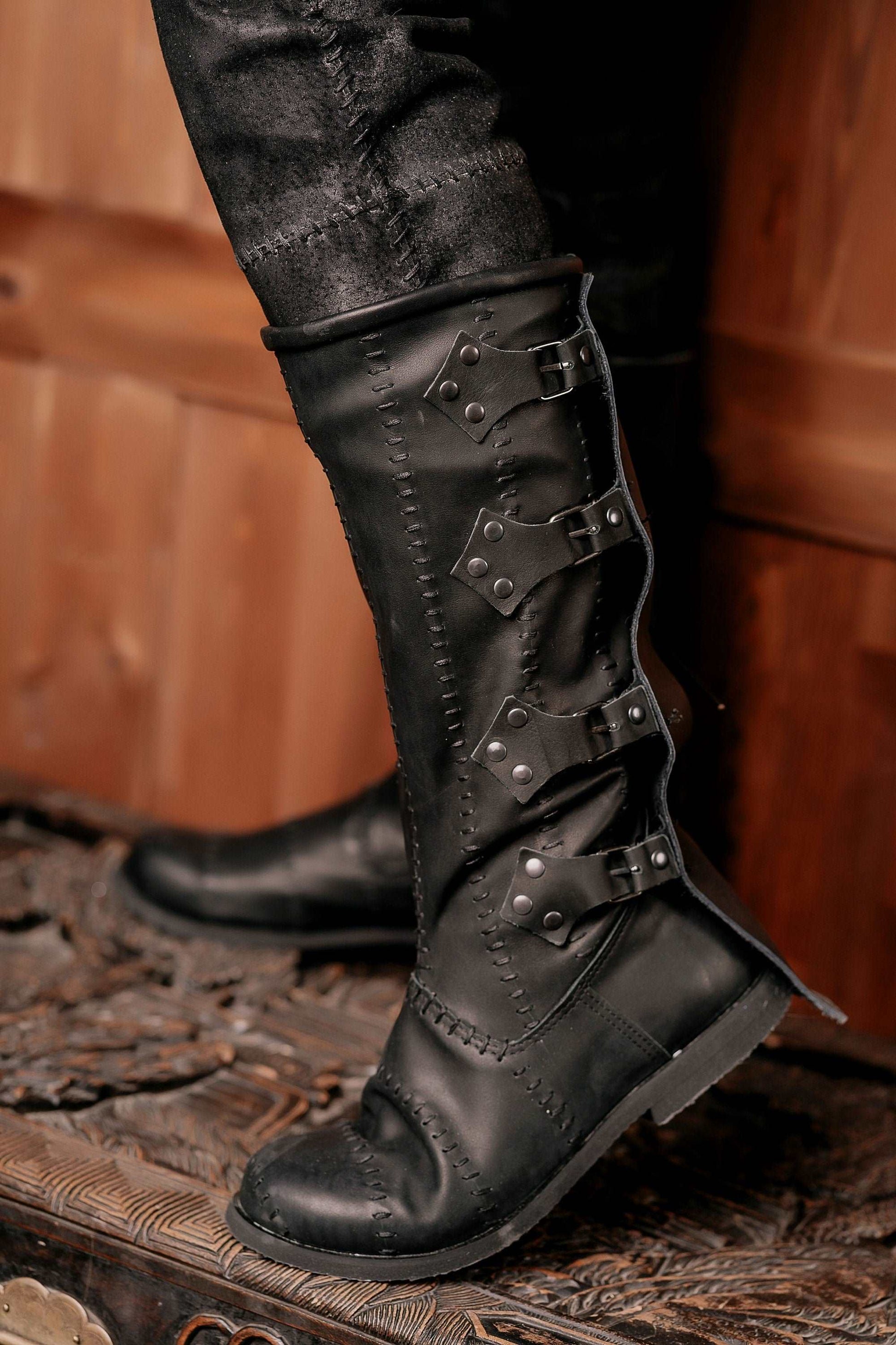 Black leather high boots with buckles