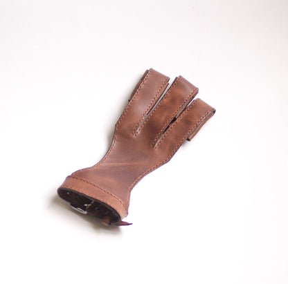 Front view of a brown leather bowstring glove with three protected fingers