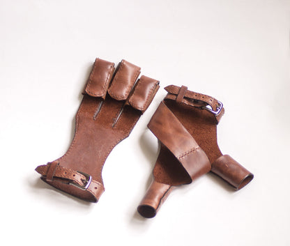 Front and back views of the handcrafted brown archery glove