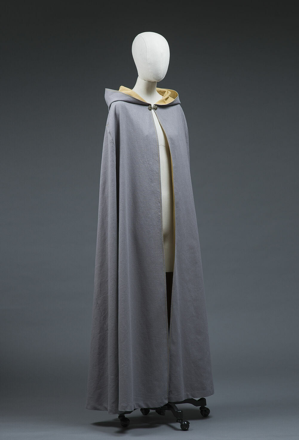 Gray-lilac cotton fantasy cloak with yellow lining, angled view