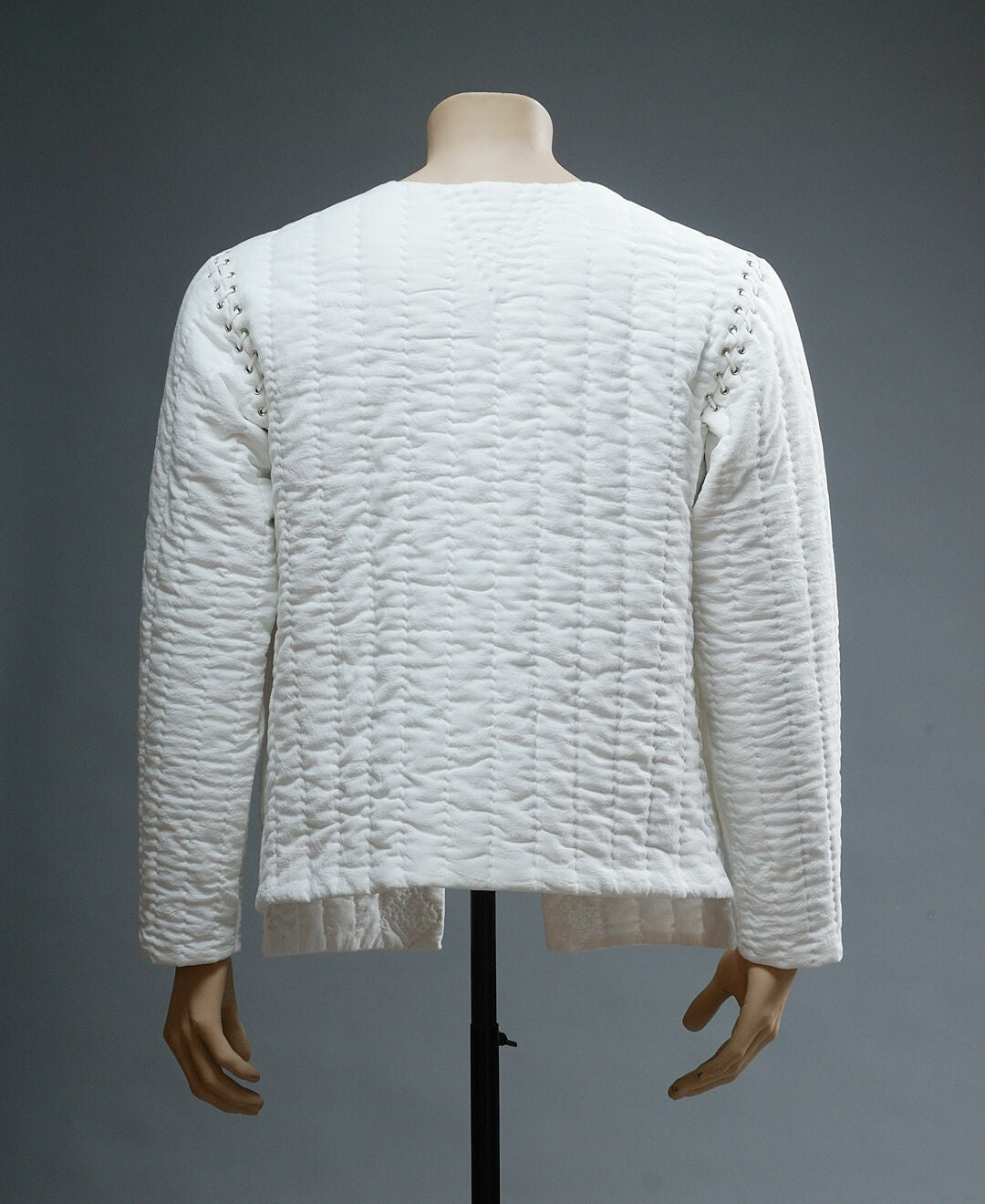 Back view of ivory quilted cotton medieval jacket