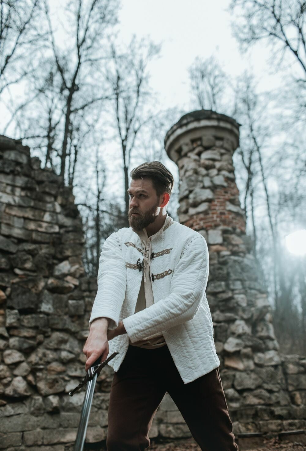 Ivory quilted jacket shown in a cinematic medieval character look
