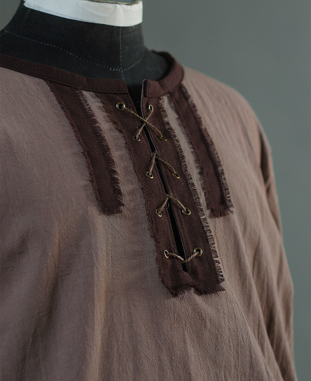 Back view of medieval cotton shirt with linen details