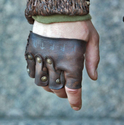 a close up of a person holding a doughnut 