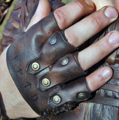 a close up of a person holding a pair of scissors 