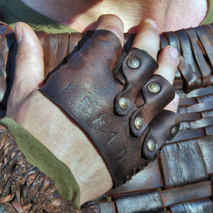 a close up of a person holding a pair of scissors 