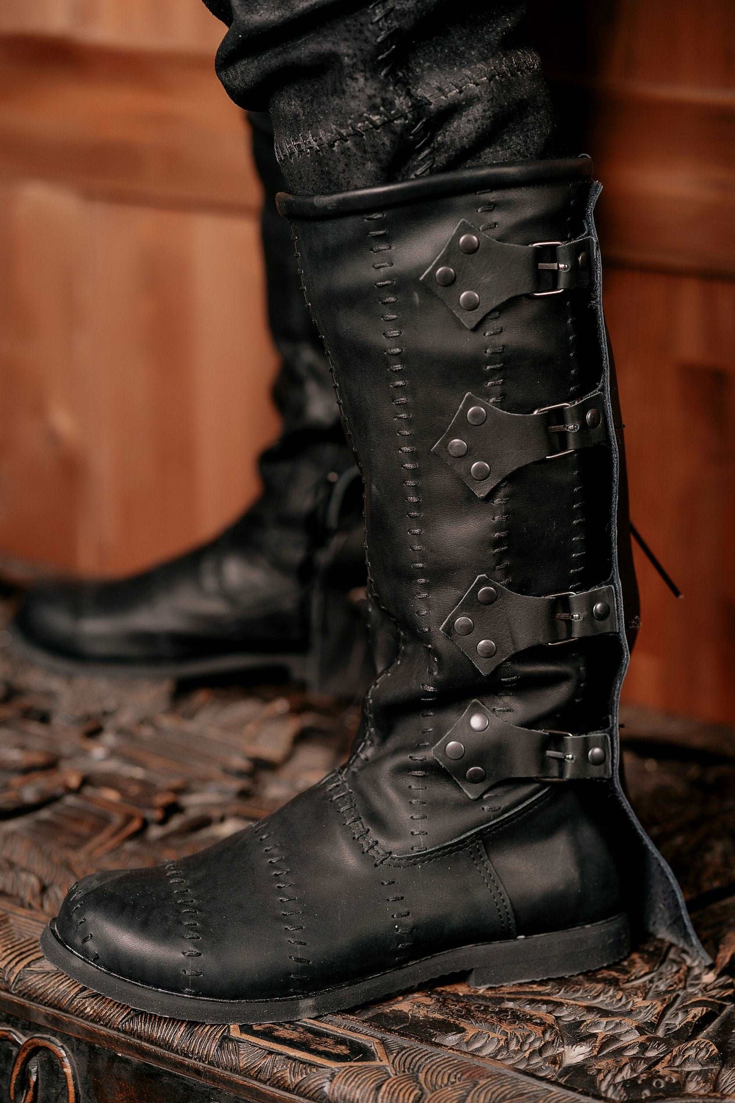 Black leather high boots with buckles