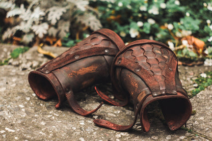 a close up of a baseball glove on the ground 