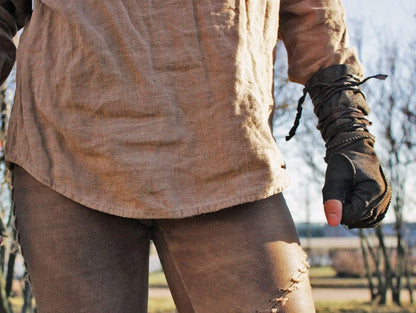 a man is holding a skateboard in his hand 