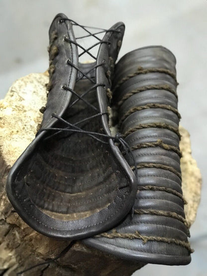 a pair of shoes sitting on top of a shoe 