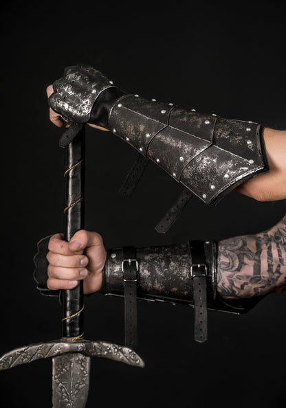 a person holding a baseball bat in a dark room 