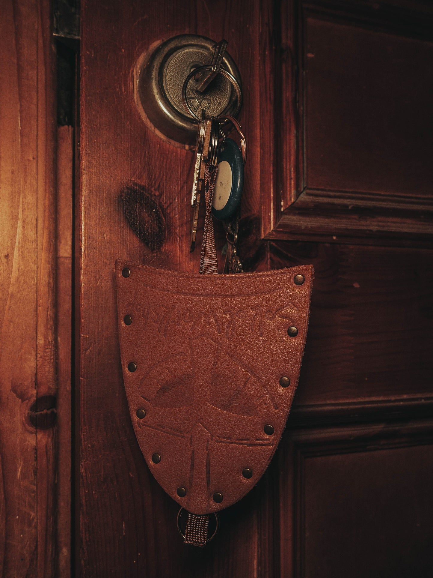 a close up of a vase on a wooden wall 