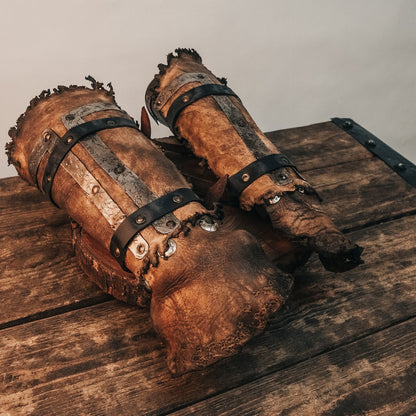 a rusted fire hydrant sitting on the ground 