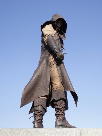 a man standing on top of a snow covered field 